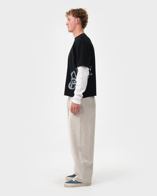 Man wearing Trackside Mock Long Sleeve Tee in Black