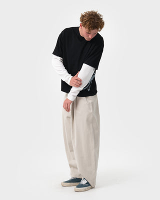 Man wearing Trackside Mock Long Sleeve Tee in Black
