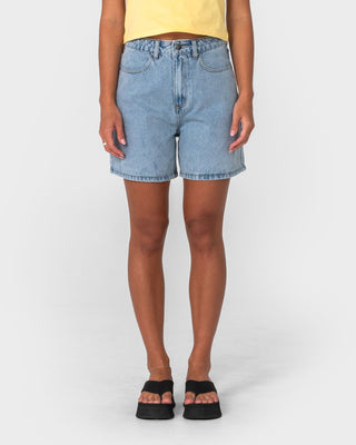 Woman wearing Cyprus High Denim Short 2.0 in True Blue