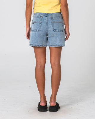Woman wearing Cyprus High Denim Short 2.0 in True Blue