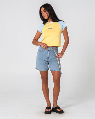 Woman wearing Cyprus High Denim Short 2.0 in True Blue