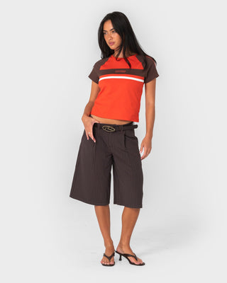 Woman wearing Big Bad Finance Mommy Low Rise Short in Java Pinstripe