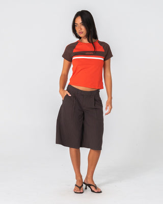 Woman wearing Big Bad Finance Mommy Low Rise Short in Java Pinstripe