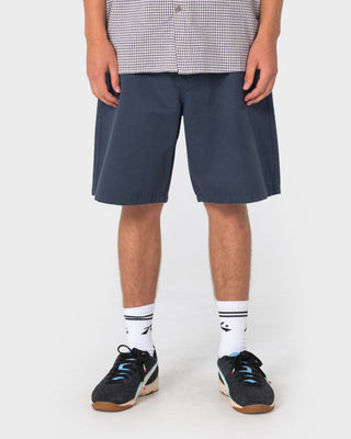 Man wearing Rumble Chino Short in Navy Blue