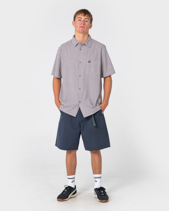 man-wearing-rumble-chino-short-in-navy-blue