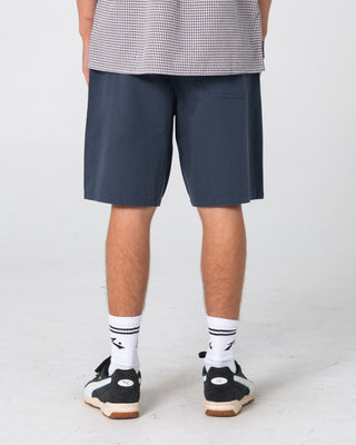 Man wearing Rumble Chino Short in Navy Blue