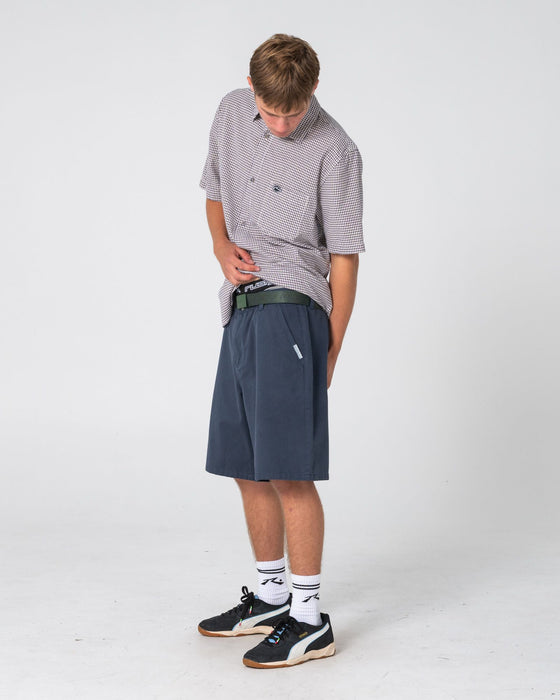 man-wearing-rumble-chino-short-in-navy-blue