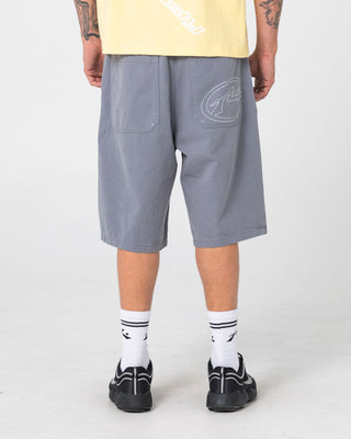 Man wearing Enigma Pleated Short in Grey