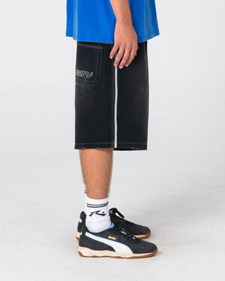 Man wearing Flip Daddy Loaded Jort in Blasted Black Out