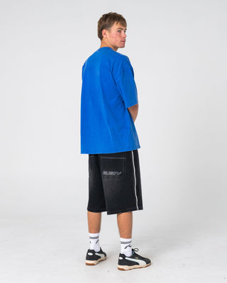 Man wearing Flip Daddy Loaded Jort in Blasted Black Out