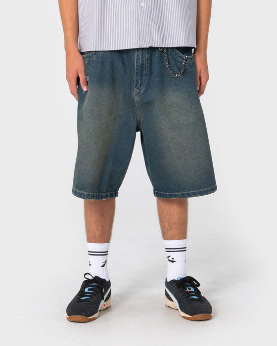man-wearing-riddler-wide-baggy-jort-in-dark-n-dirty