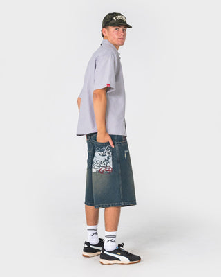 man-wearing-riddler-wide-baggy-jort-in-dark-n-dirty