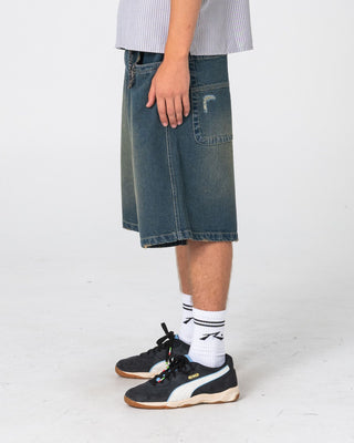 Man wearing Riddler Wide Baggy Jort in Dark N Dirty
