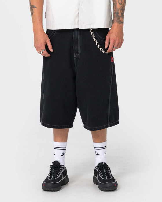 man-wearing-point-zero-engineered-jort-in-black-out