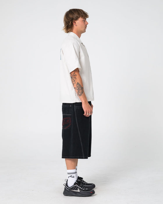 man-wearing-point-zero-engineered-jort-in-black-out