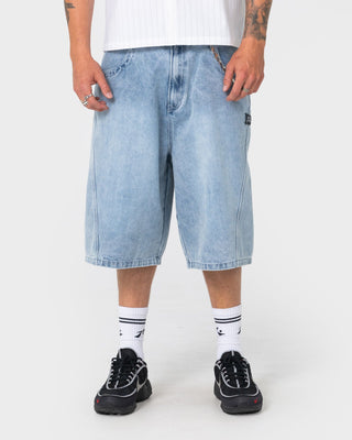 Man wearing Point Zero Engineered Jort in Indigo Slub Blue