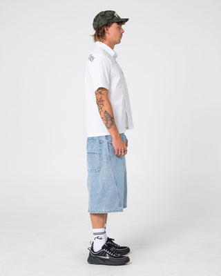 Man wearing Point Zero Engineered Jort in Indigo Slub Blue