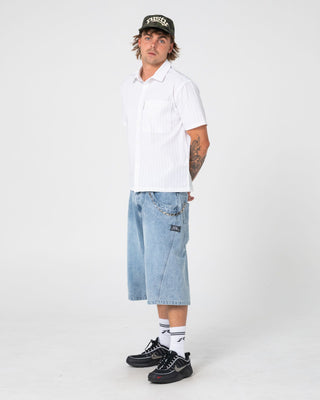 Man wearing Point Zero Engineered Jort in Indigo Slub Blue