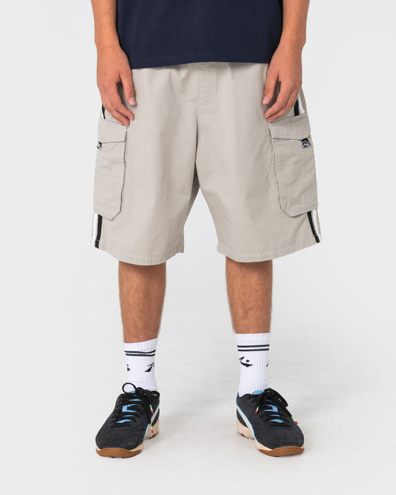 man-wearing-8-ball-elastic-cargo-short-in-stone-grey