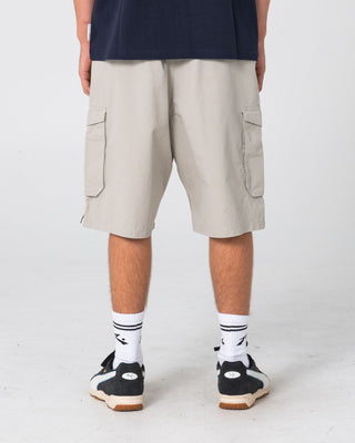 Man wearing 8-ball Elastic Cargo Short in Stone Grey