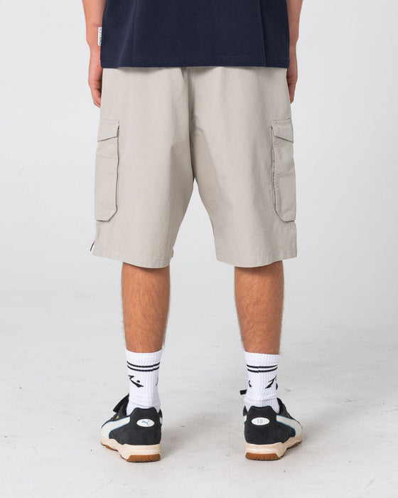 man-wearing-8-ball-elastic-cargo-short-in-stone-grey