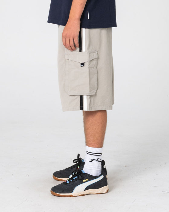 man-wearing-8-ball-elastic-cargo-short-in-stone-grey