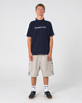Man wearing 8-ball Elastic Cargo Short in Stone Grey