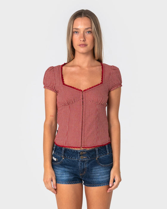 woman-wearing-hook-me-peggy-blouse-in-red-check