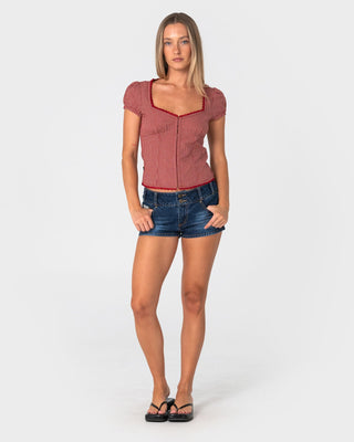 Woman wearing Hook Me Peggy Blouse in Red Check
