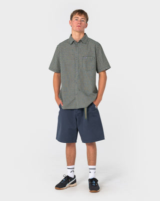 Man wearing Datsun Check Short Sleeve Shirt in Dark Green