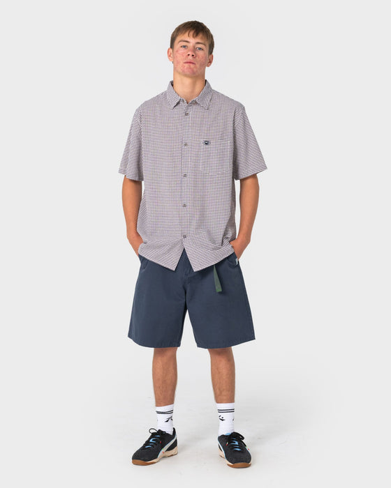 man-wearing-datsun-check-short-sleeve-shirt-in-navy-blue