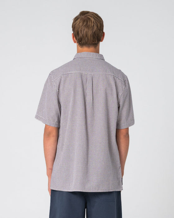 man-wearing-datsun-check-short-sleeve-shirt-in-navy-blue