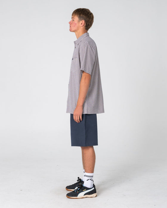 man-wearing-datsun-check-short-sleeve-shirt-in-navy-blue