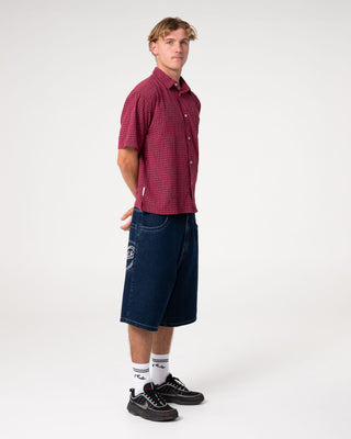 Man wearing Defender Dennis Short Sleeve Shirt in Vintage Red