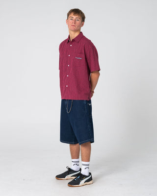 Man wearing Defender Dennis Short Sleeve Shirt in Vintage Red