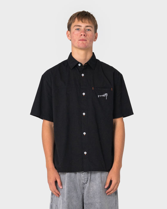 man-wearing-far-away-short-sleeve-shirt-in-black