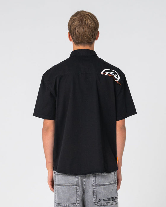 man-wearing-far-away-short-sleeve-shirt-in-black