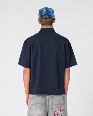 Man wearing Shockwave Short Sleeve Shirt in Navy Blue