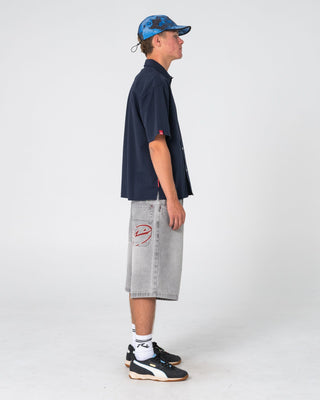 Man wearing Shockwave Short Sleeve Shirt in Navy Blue