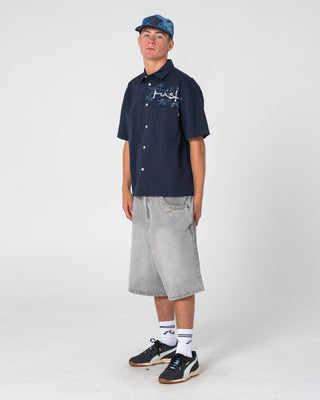 Man wearing Shockwave Short Sleeve Shirt in Navy Blue