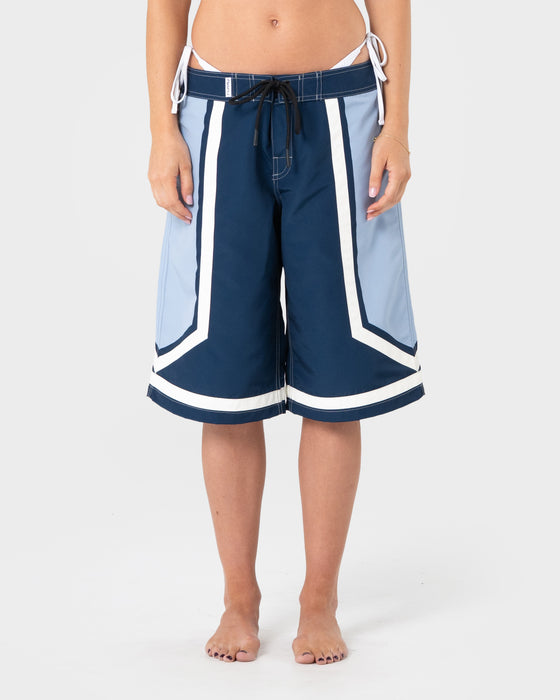 woman-wearing-farrah-long-boardshorts-in-navy-blue
