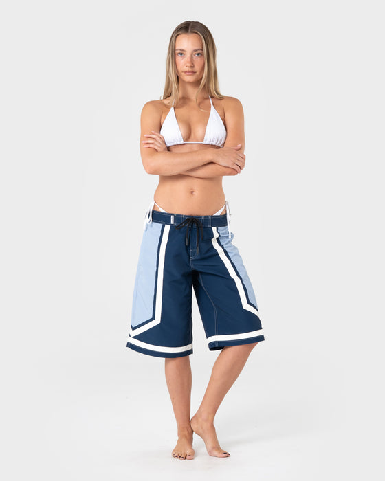 woman-wearing-farrah-long-boardshorts-in-navy-blue