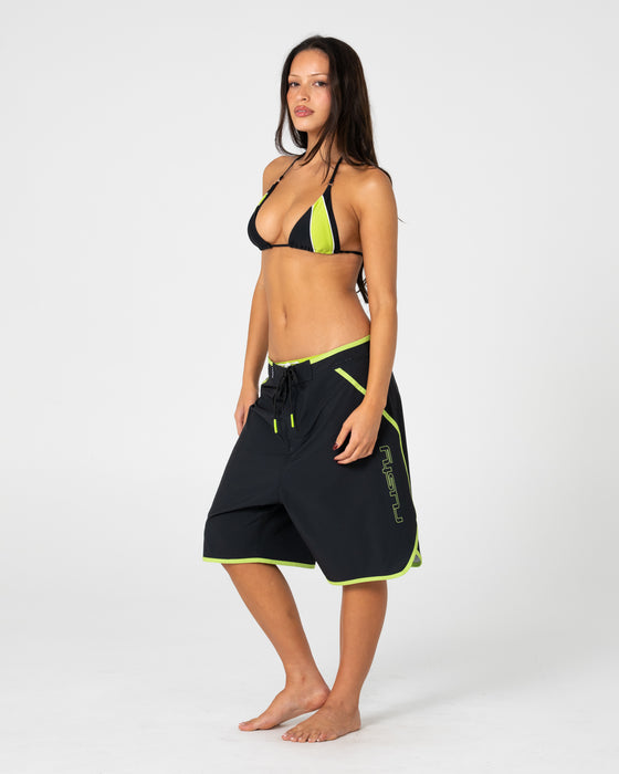 woman-wearing-voltron-22-camo-boardshort-in-black