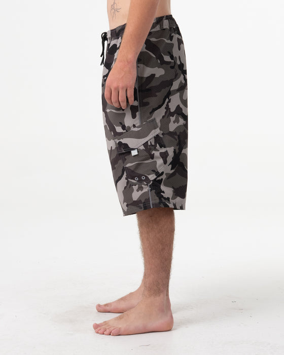 man-wearing-tropik-25-baggy-camo-boardshort-in-army-green