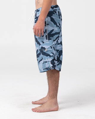 Man wearing Tropik 25 Baggy Camo Boardshort in Navy Blue