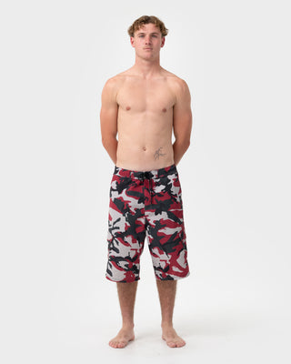 Man wearing Tropik 25 Baggy Camo Boardshort in Vintage Red