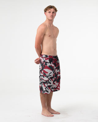 Man wearing Tropik 25 Baggy Camo Boardshort in Vintage Red