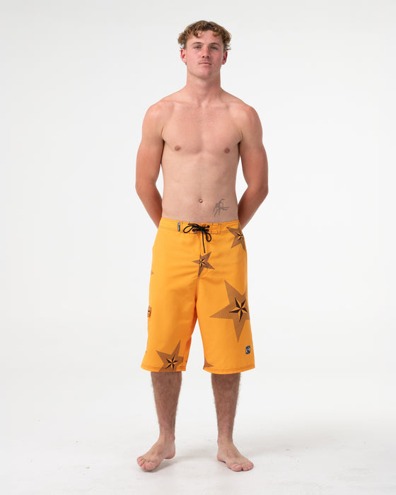man-wearing-knievil-25-baggy-boardshort-in-gold-fusion