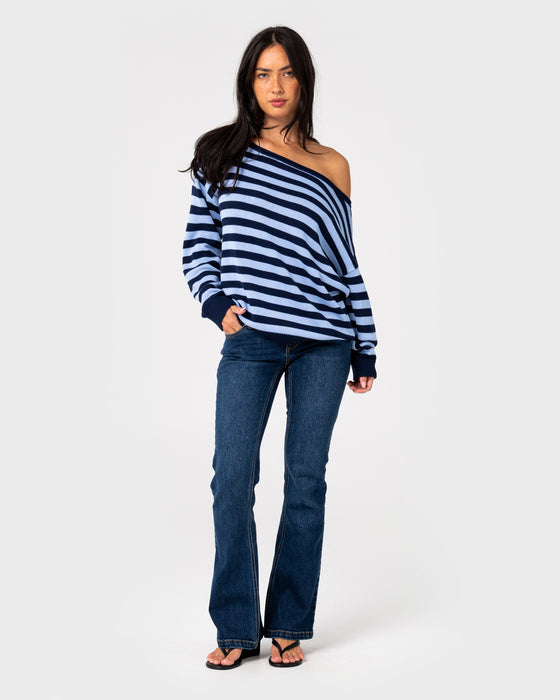 woman-wearing-stella-stripe-slouch-knit-in-navy-blue-retro-blue