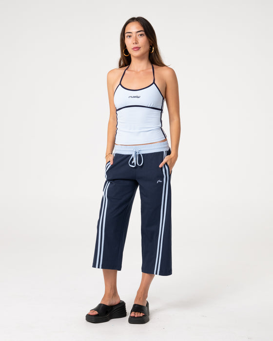 woman-wearing-maneater-fitted-halter-top-in-retro-blue-navy
